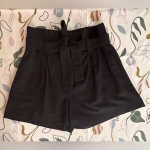 BR Black paper bag high-waisted shorts.